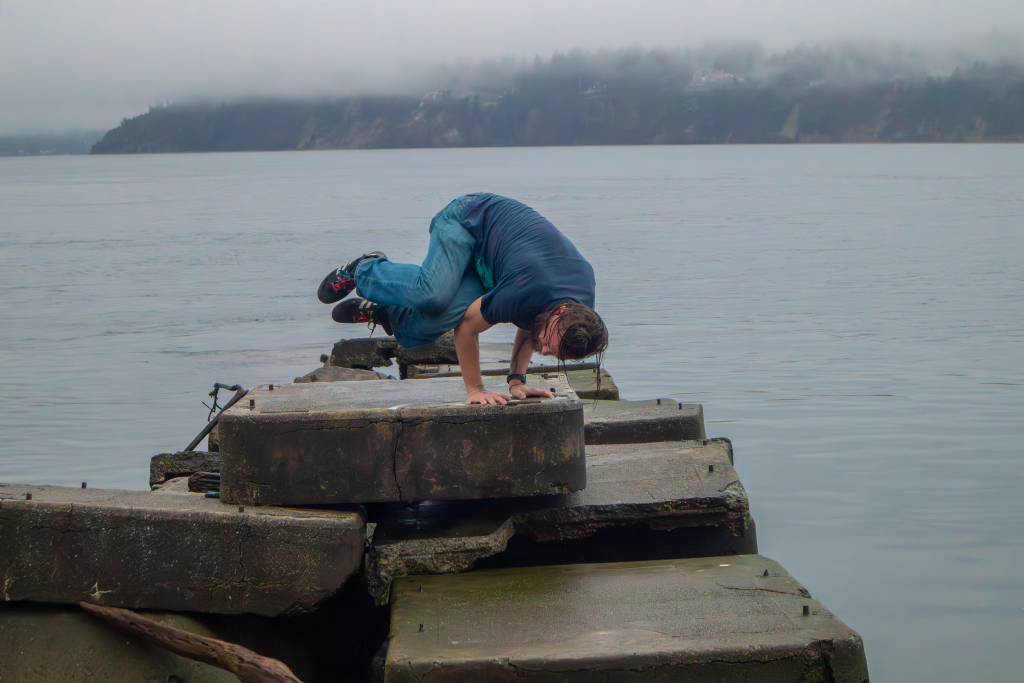 Smokestack doing side crow on a jetty at Titlow Park in Tacoma, WA.